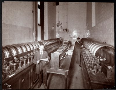 Men Sending Mail Out from a Pneumatic Tube Transport Room at the Metropolitan Life Insurance Co. at 23rd Street and Madison Avenue, New York, 1907 by Byron Company
